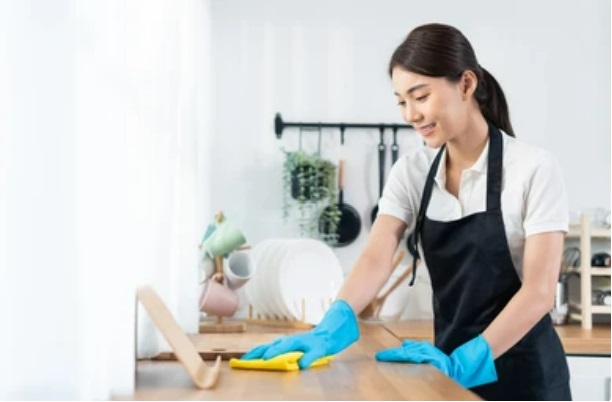 Woman wiping the table